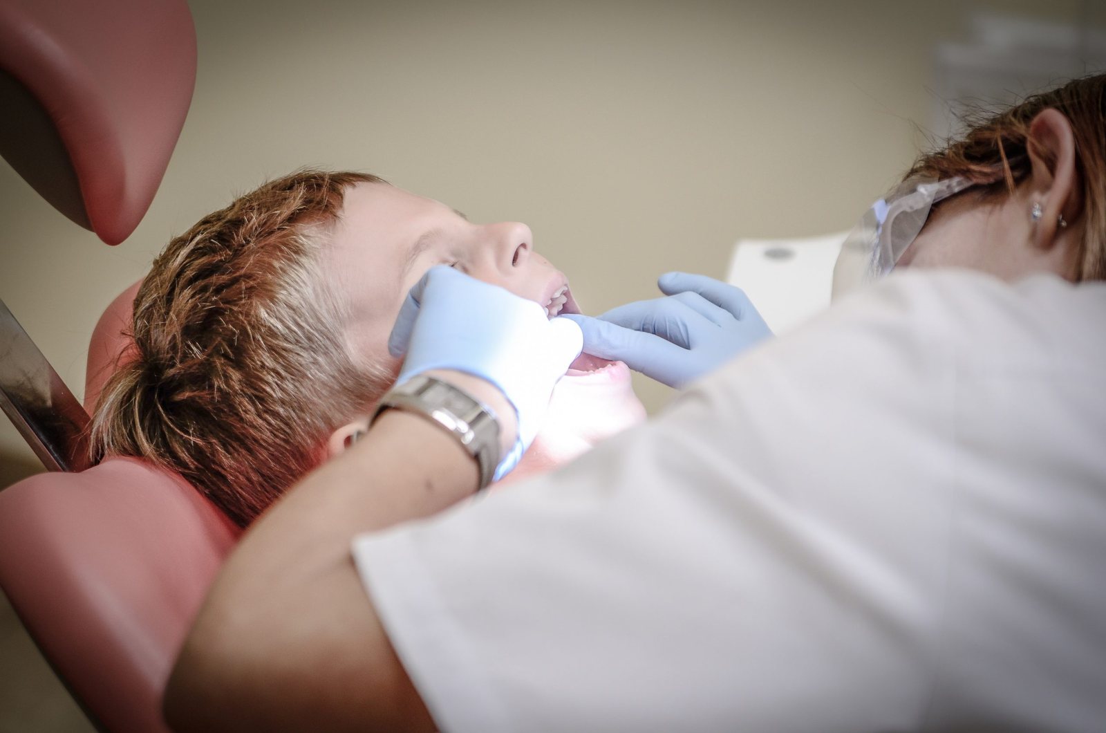 Dentist treating a patient in a dental chair