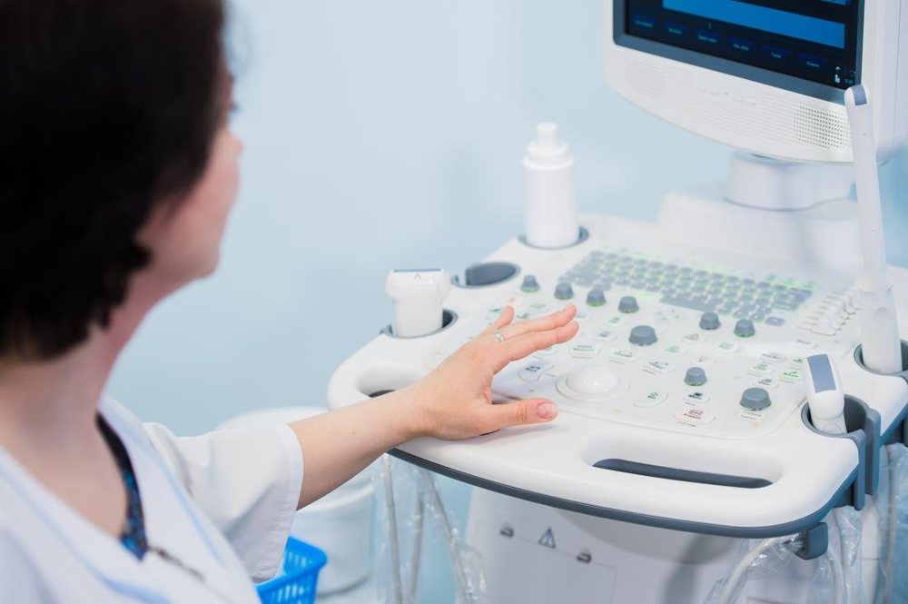 Medical professional using an ultrasound scanner